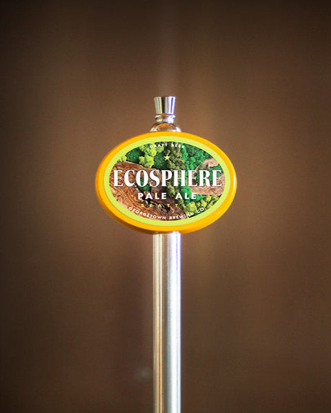tap handle with the ecosphere label featuring images of varying green mosses. 