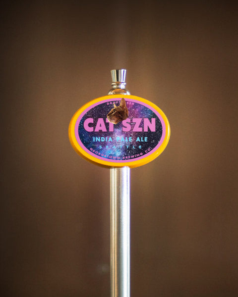 photo of tap handle with Cat Szn label featuring a cat head